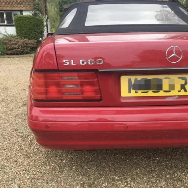 Colour-matched rear parking sensors on a red Mercedes-Benz SL 600